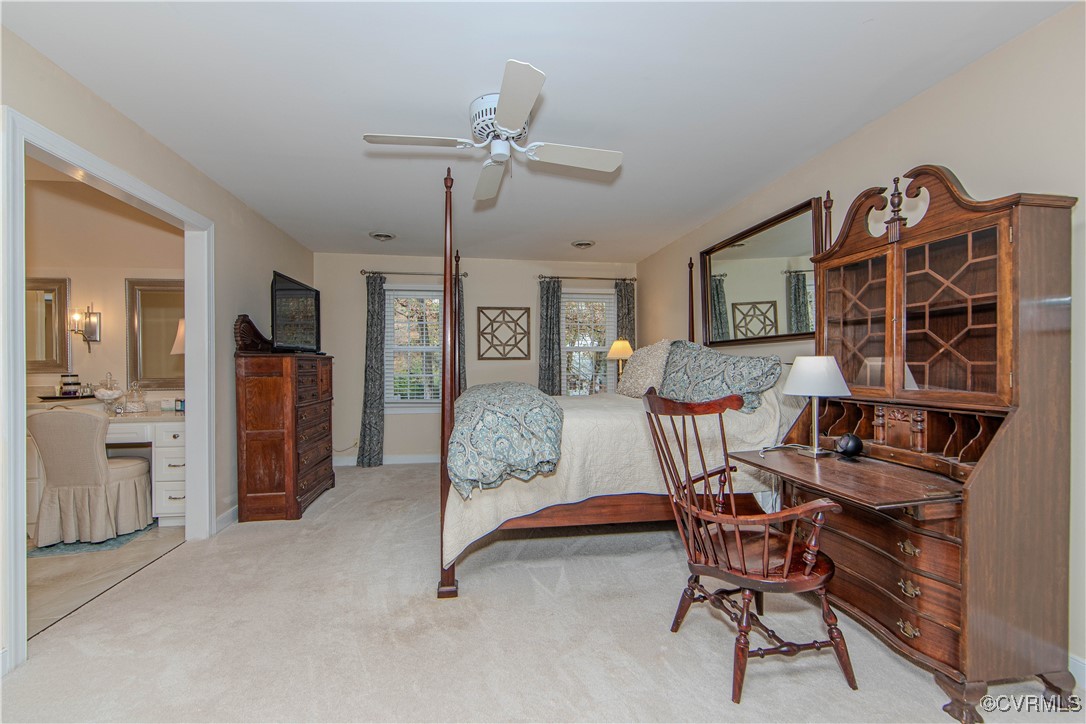 14161 Grangewood Road Midlothian, VA 23113 - Photo 21 of 44 a living room with furniture a ceiling fan and a window