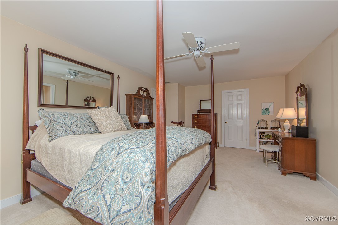 14161 Grangewood Road Midlothian, VA 23113 - Photo 22 of 44 a bedroom with a bed and ceiling fan