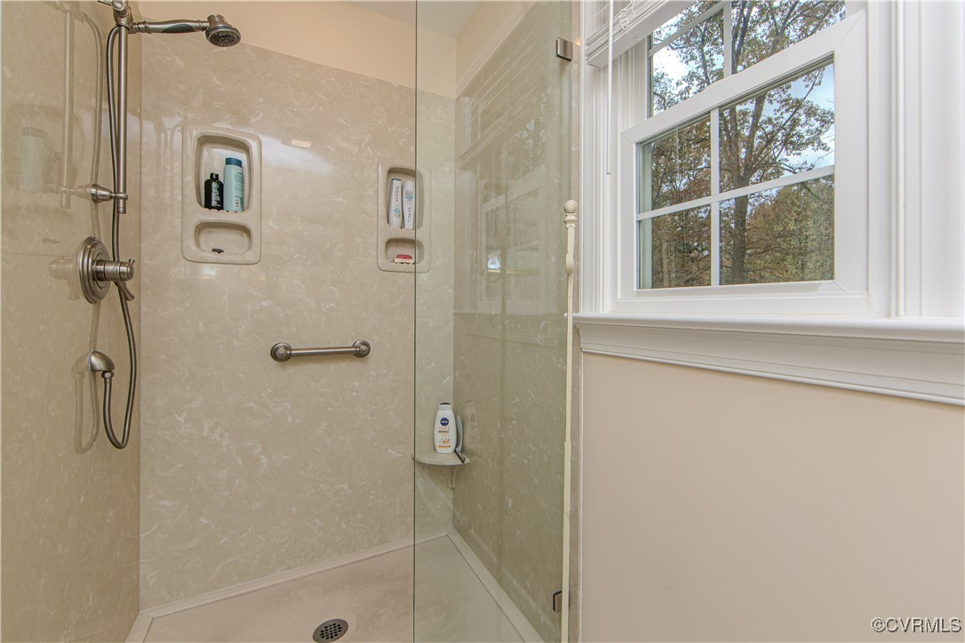14161 Grangewood Road Midlothian, VA 23113 - Photo 25 of 44 a bathroom with a glass shower door