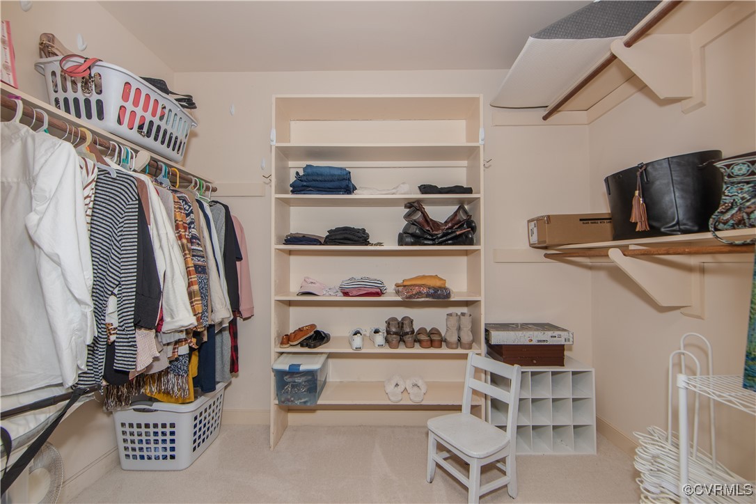 14161 Grangewood Road Midlothian, VA 23113 - Photo 26 of 44 a view of walk in closet with clothes and shoes