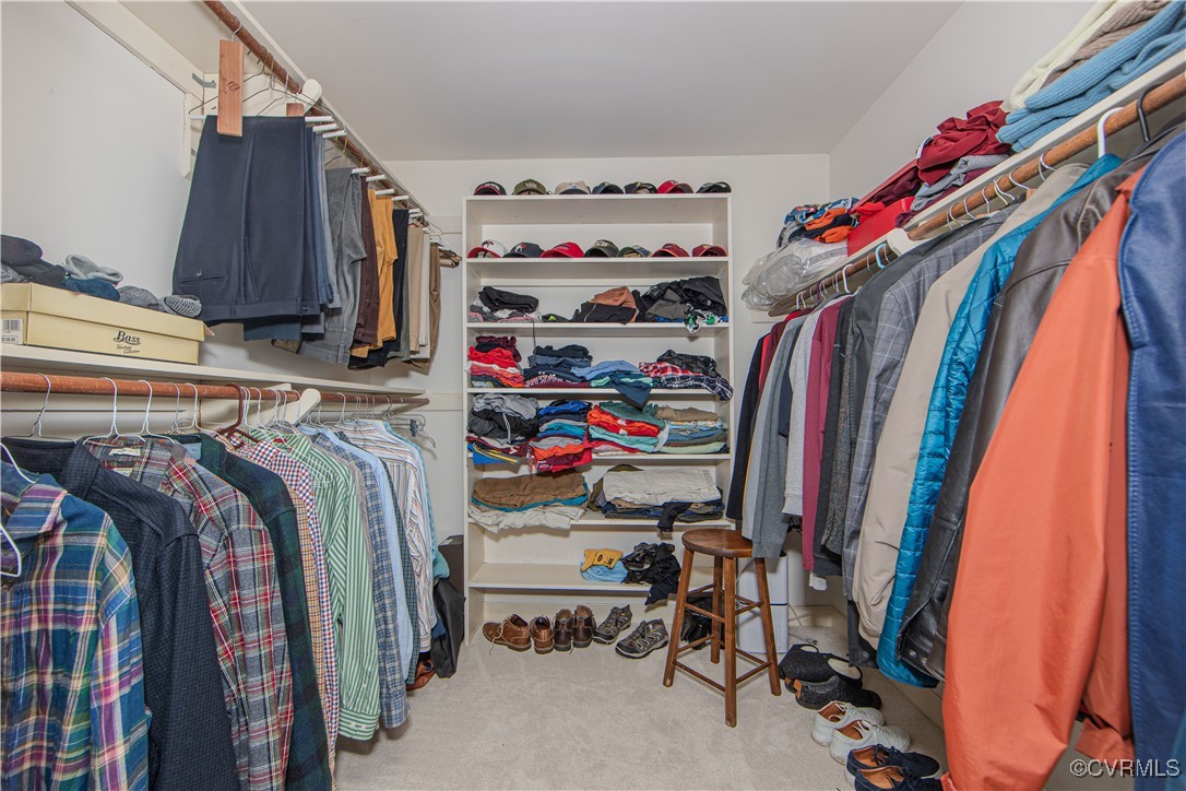14161 Grangewood Road Midlothian, VA 23113 - Photo 27 of 44 a view of walk in closet with clothes and shoes