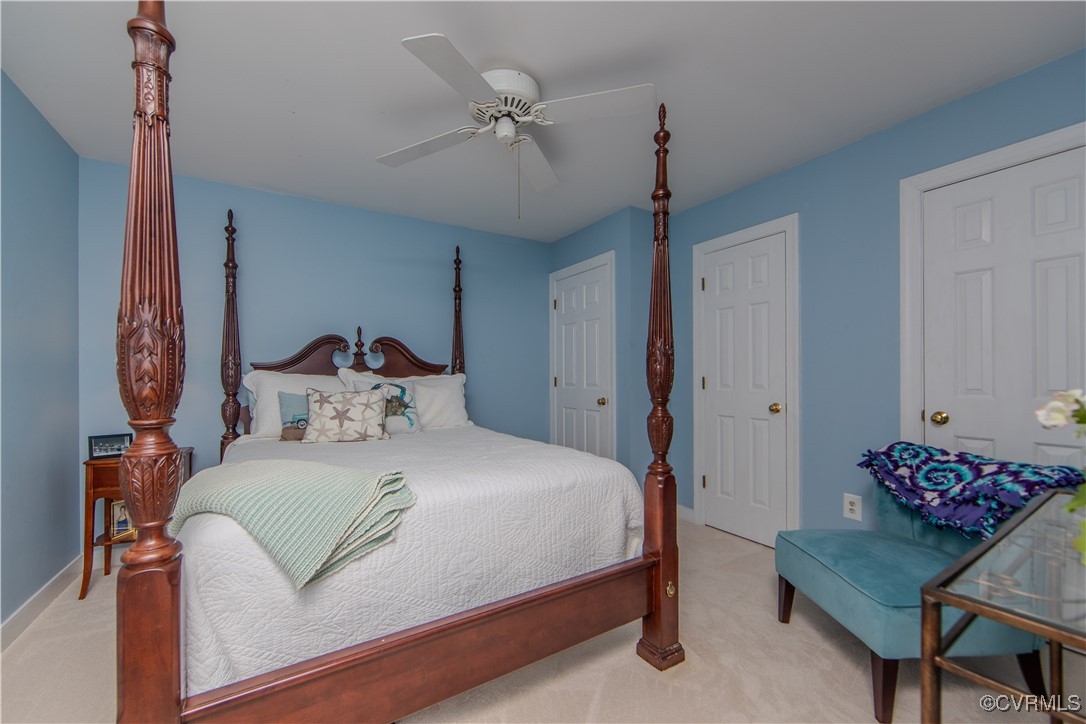 14161 Grangewood Road Midlothian, VA 23113 - Photo 30 of 44 a bedroom with a bed and a chandelier