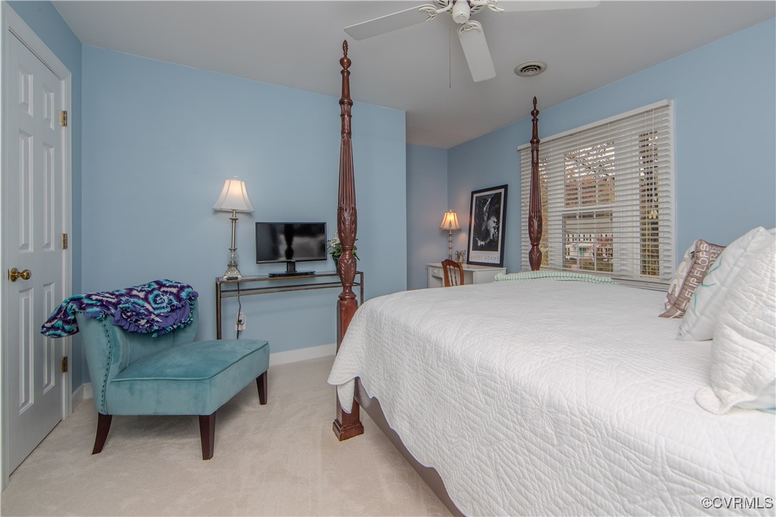 14161 Grangewood Road Midlothian, VA 23113 - Photo 31 of 44 a spacious bedroom with a bed and a couch