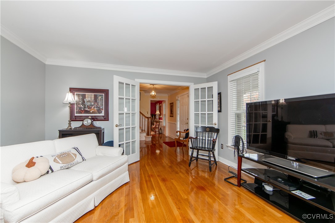 14161 Grangewood Road Midlothian, VA 23113 - Photo 7 of 44 a living room with furniture and a flat screen tv