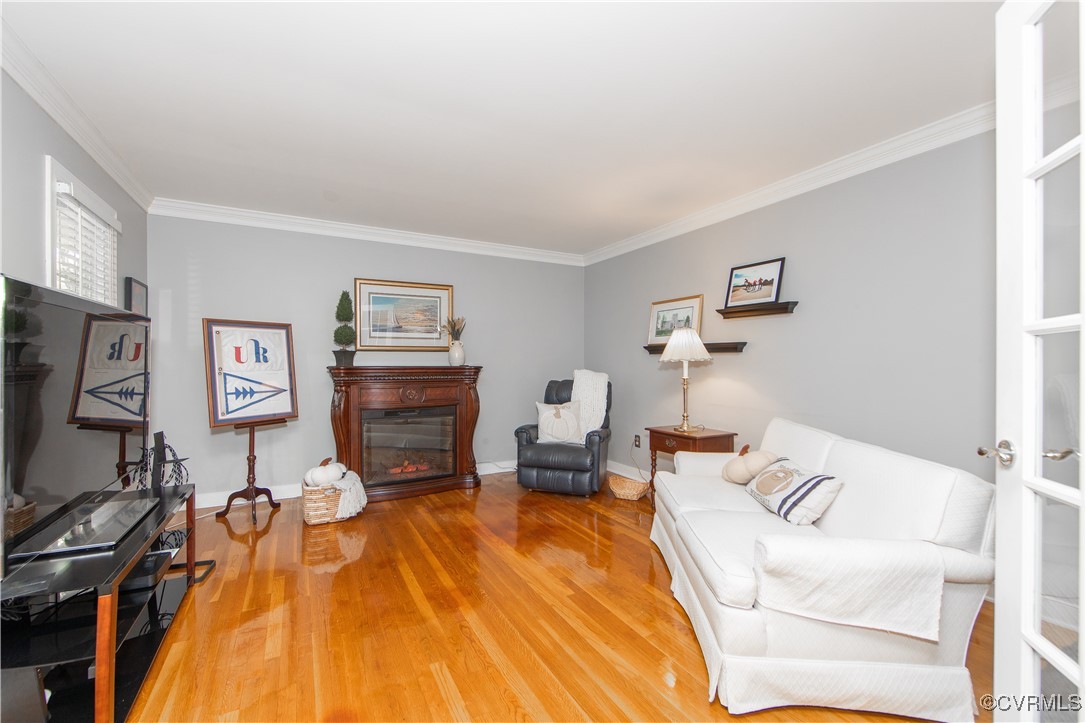 14161 Grangewood Road Midlothian, VA 23113 - Photo 8 of 44 a living room with furniture and a flat screen tv