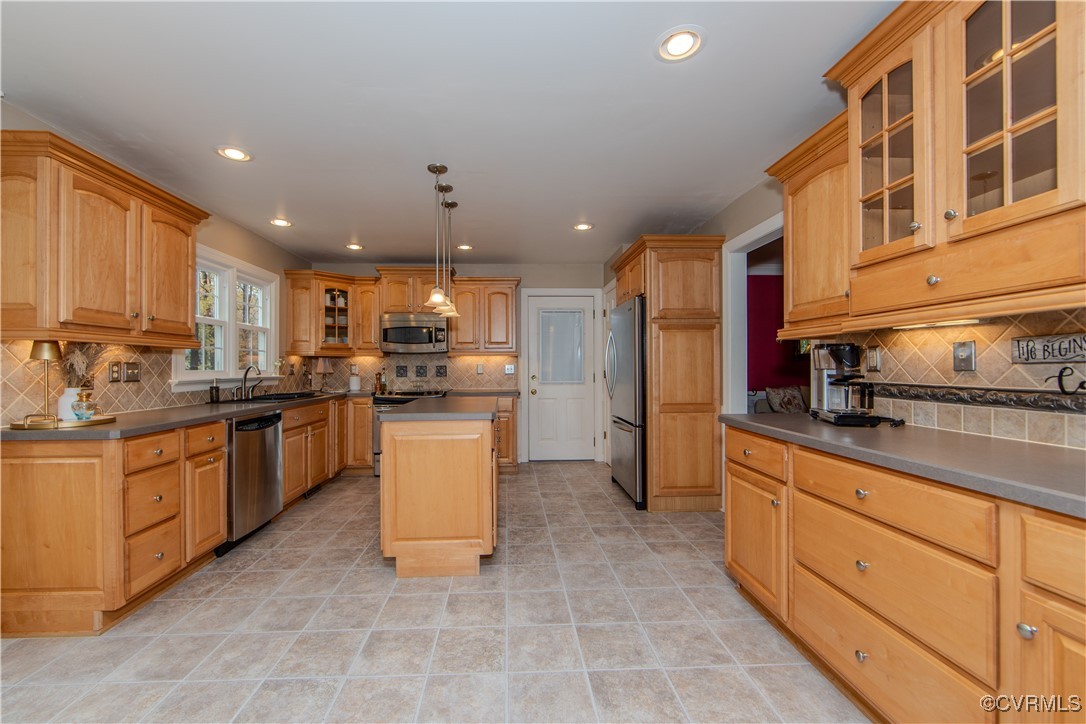 14161 Grangewood Road Midlothian, VA 23113 - Photo 9 of 44 a kitchen with stainless steel appliances granite countertop a stove top oven a sink and a refrigerator