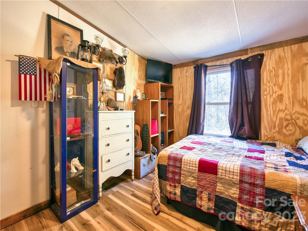 994 Indian Springs Road Clyde, NC 28721 - Photo 36 of 39 a bedroom with a bed and a window