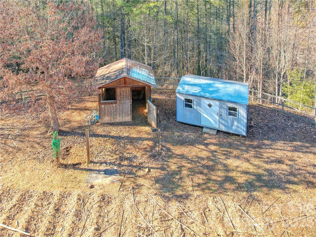 994 Indian Springs Road Clyde, NC 28721 - Photo 7 of 39 a view of a house with backyard and trees