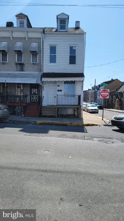 a view of a car park in front of house