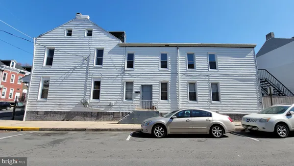 a view of a car parked in front of a house