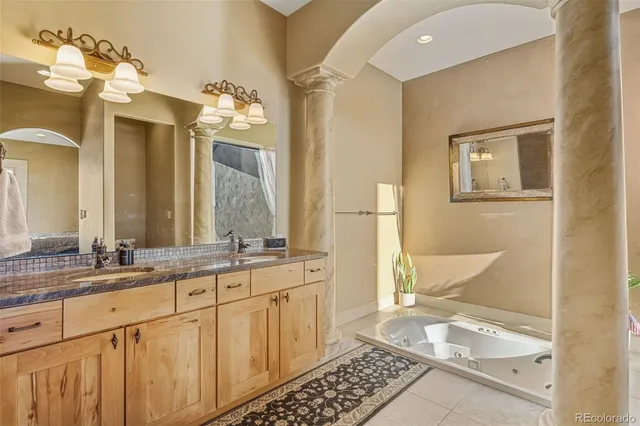 a bathroom with a double vanity sink and a mirror