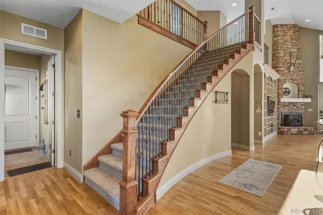 a view of entryway and hall with wooden floor