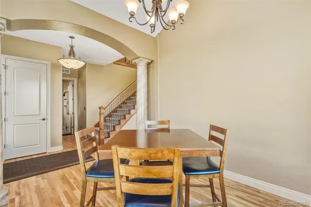 a view of a dining room with furniture and wooden floor