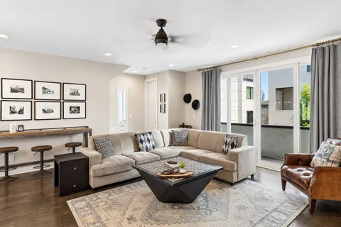 a living room with furniture and a rug