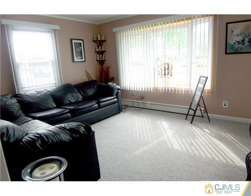 86 West Hill Road Colonia, NJ 07067 - Photo 2 of 10 a living room with furniture and a window