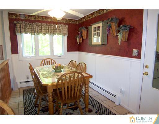 86 West Hill Road Colonia, NJ 07067 - Photo 4 of 10 a view of a dining room with furniture and window