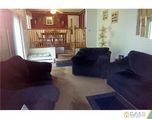 86 West Hill Road Colonia, NJ 07067 - Photo 5 of 10 a living room with furniture and a large window