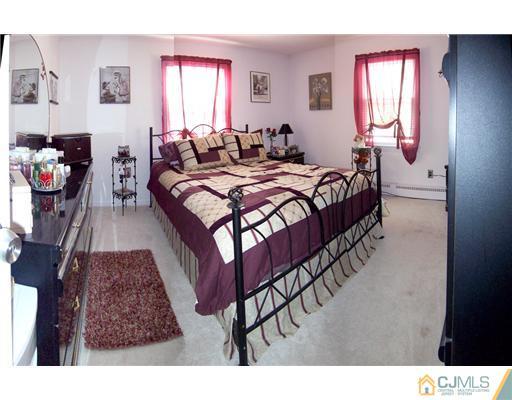 86 West Hill Road Colonia, NJ 07067 - Photo 6 of 10 a bed room with a bed and a window