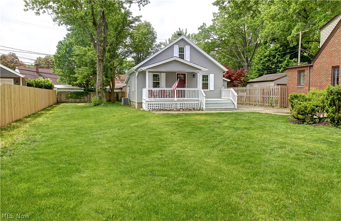 14507 Glencliffe Road Cleveland, OH 44111 - Photo 2 of 31 Rear view of house featuring a wooden deck and a yard
