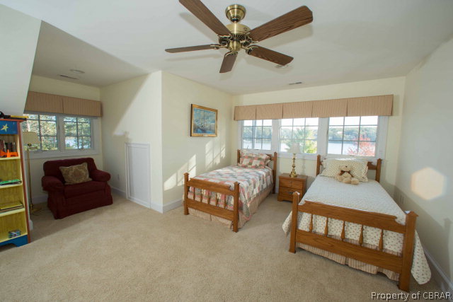 87 Eagle Point Road Lancaster, VA 22503 - Photo 31 of 36 a bedroom with two beds and window