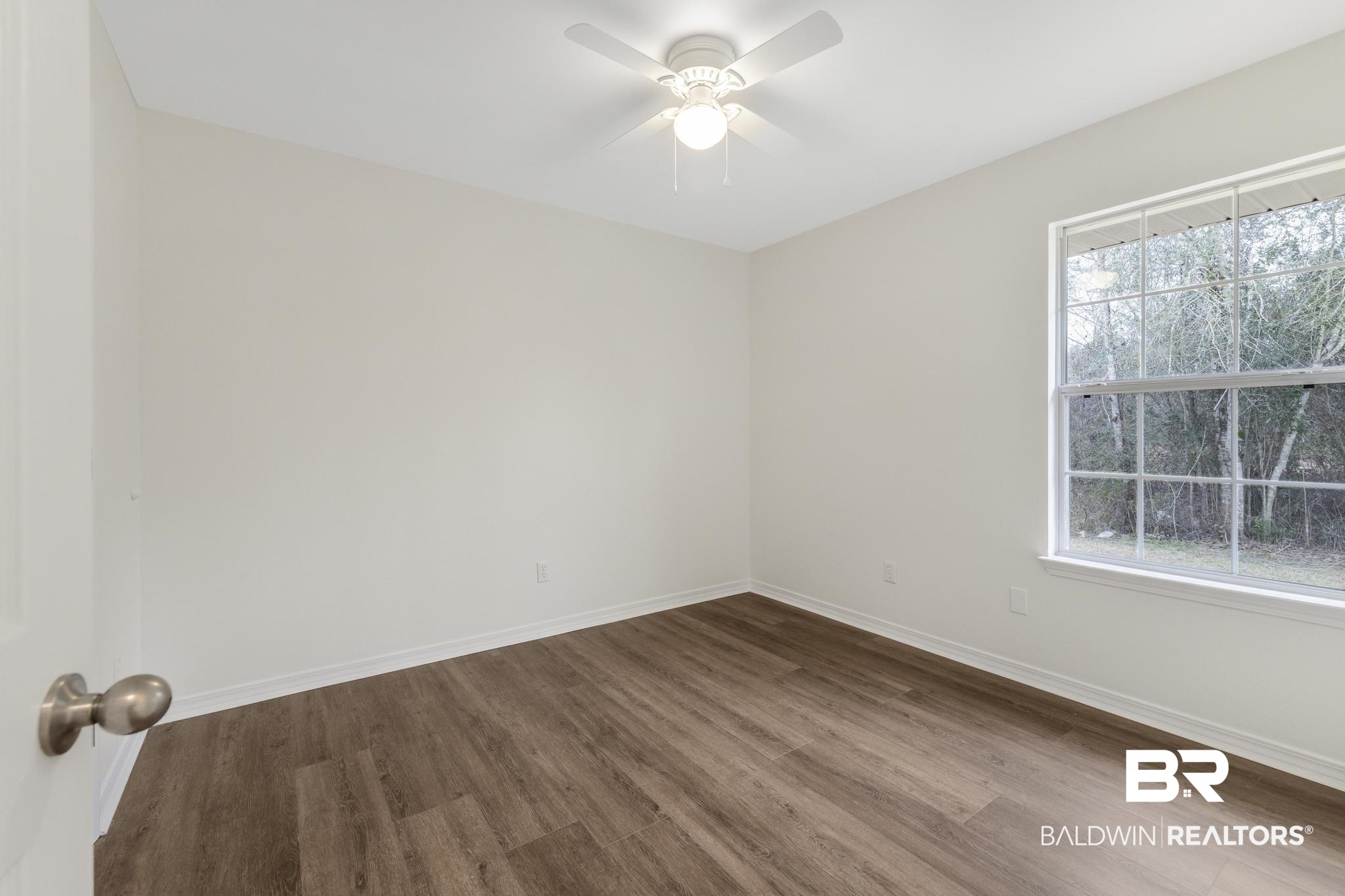 16330 Absalom Street Foley, AL 36535 - Photo 32 of 42 Unfurnished room with wood-type flooring and ceiling fan
