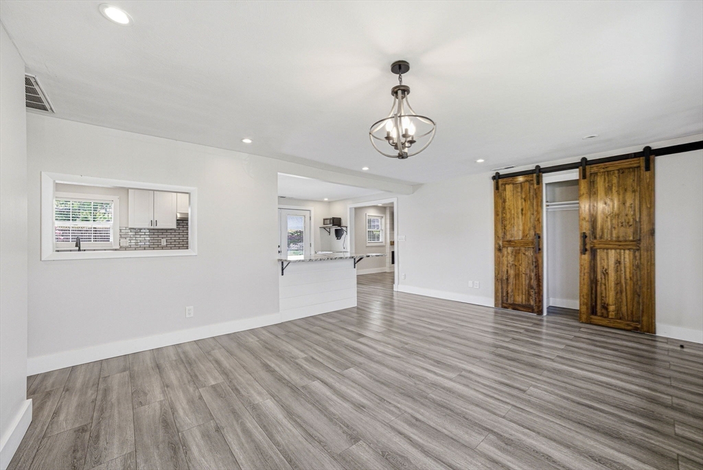 157 Errol Road Brockton, MA 02302 - Photo 15 of 34 a view of an empty room with wooden floor and a window