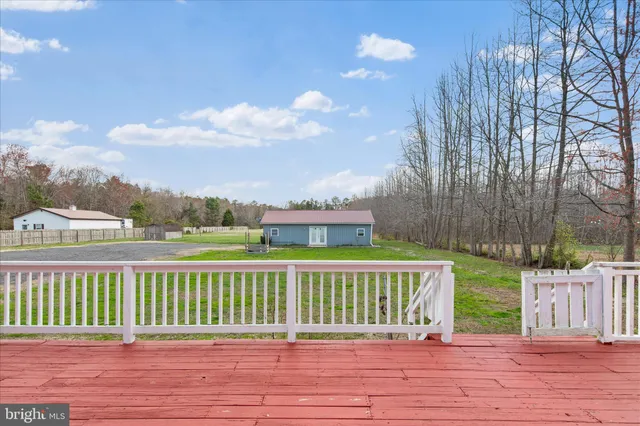 a view of a deck and yard