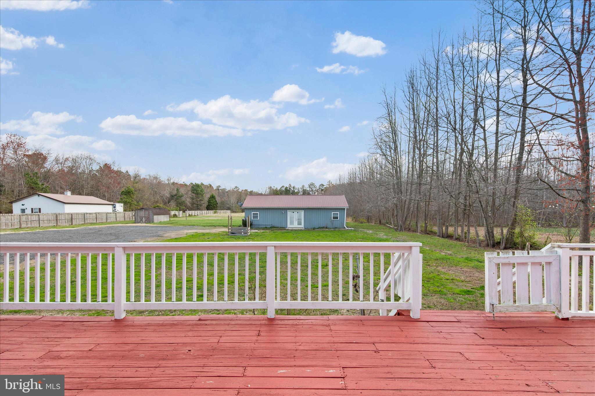 14477 Deer Forest Road Bridgeville, DE 19933 - Photo 2 of 22 a view of a deck and yard