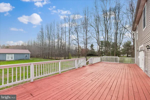 a balcony with wooden floor