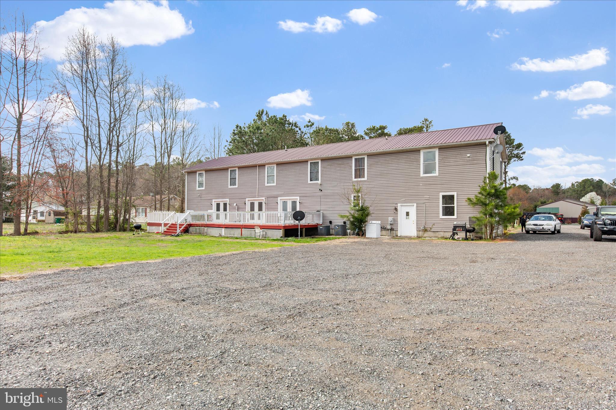 14477 Deer Forest Road Bridgeville, DE 19933 - Photo 9 of 22 a view of an house with backyard and plants