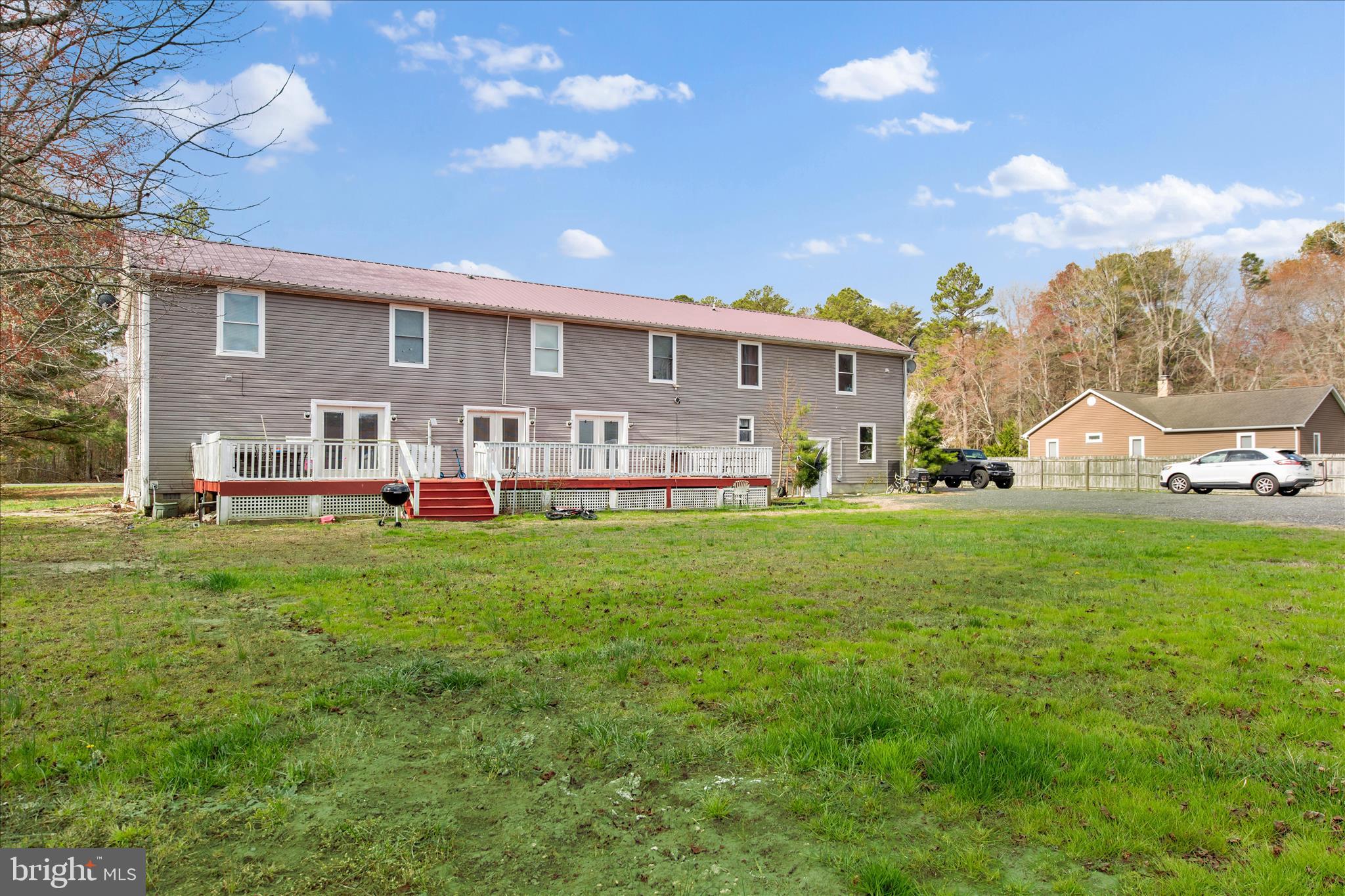 14477 Deer Forest Road Bridgeville, DE 19933 - Photo 10 of 22 a view of a house with big yard and large trees