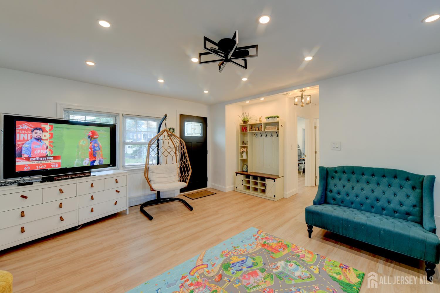 50 Chestnut Street Edison, NJ 08817 - Photo 1 of 36 a living room with furniture and a flat screen tv