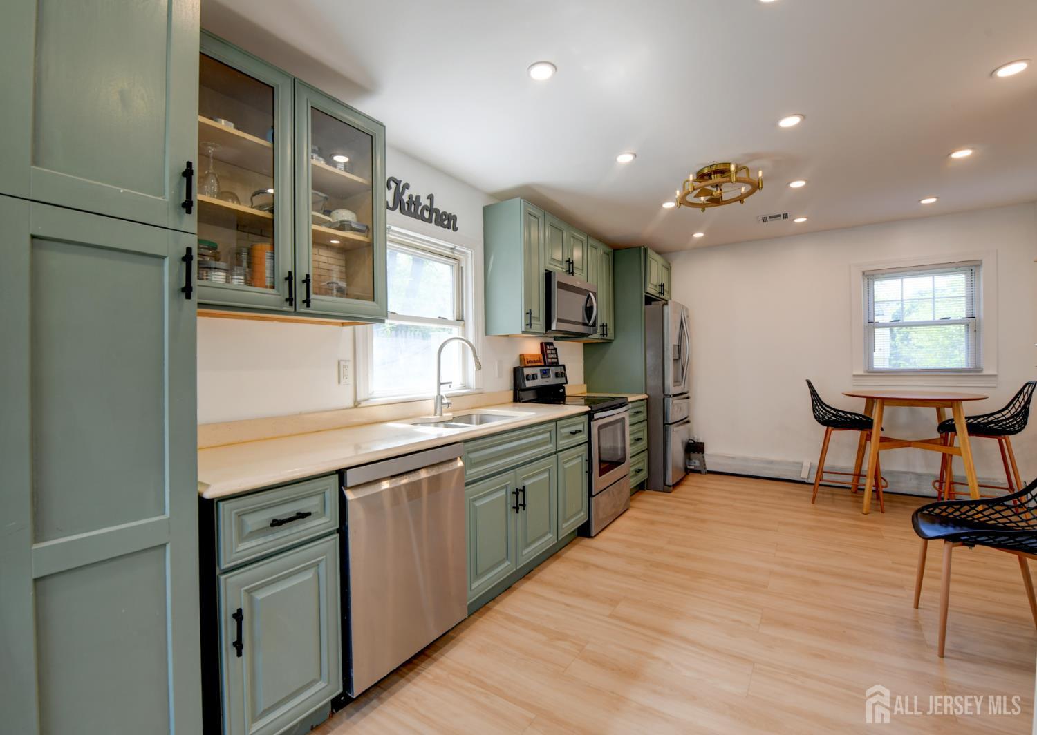 50 Chestnut Street Edison, NJ 08817 - Photo 11 of 36 a kitchen with stainless steel appliances granite countertop counter space a sink and cabinets
