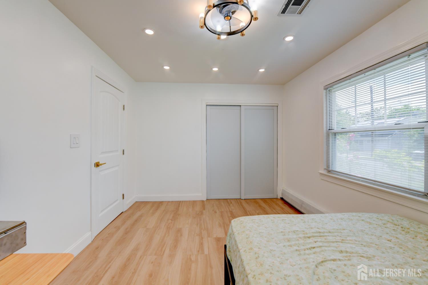 50 Chestnut Street Edison, NJ 08817 - Photo 17 of 36 a bedroom with a bed and a window