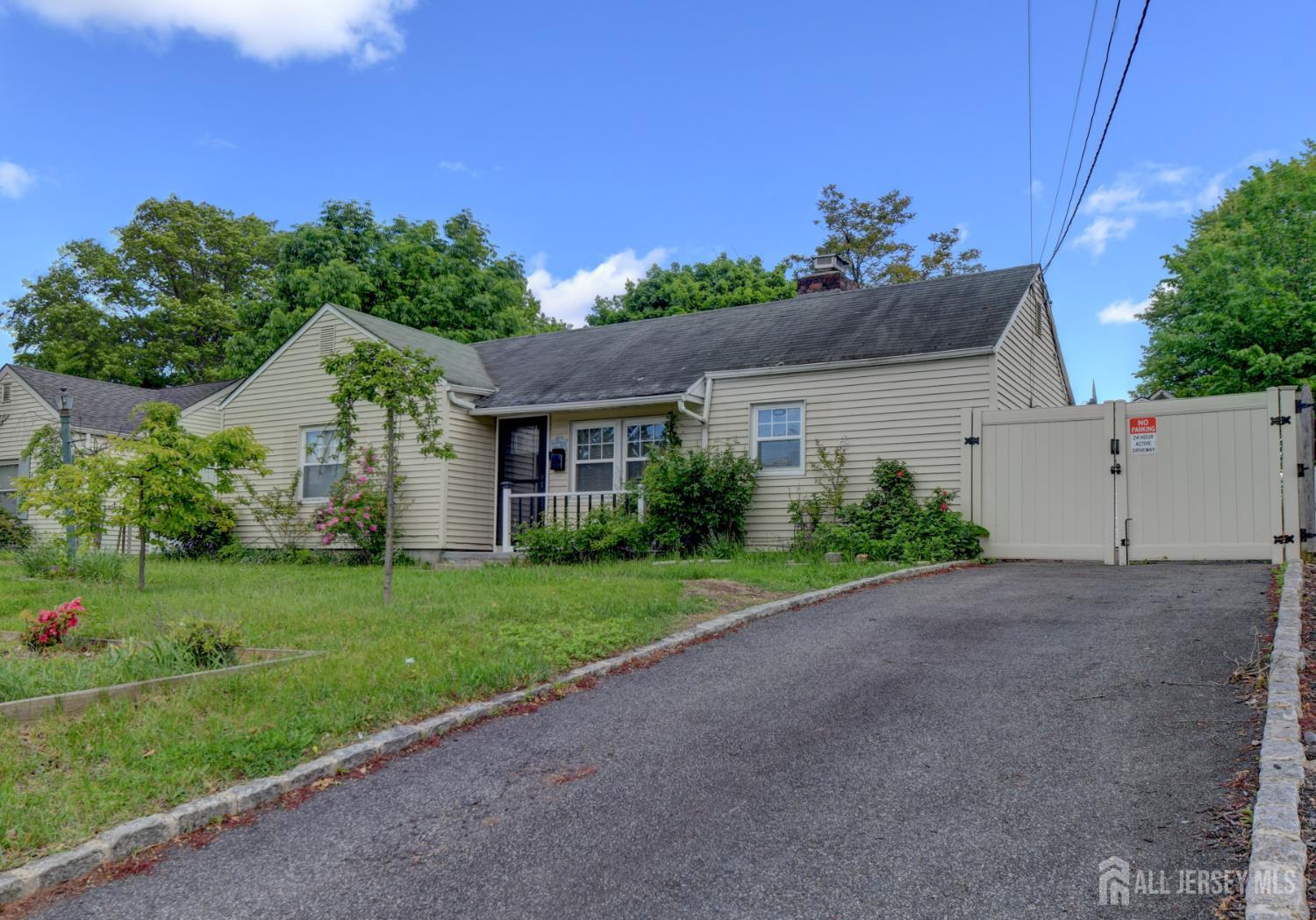 50 Chestnut Street Edison, NJ 08817 - Photo 2 of 36 a front view of a house with a yard
