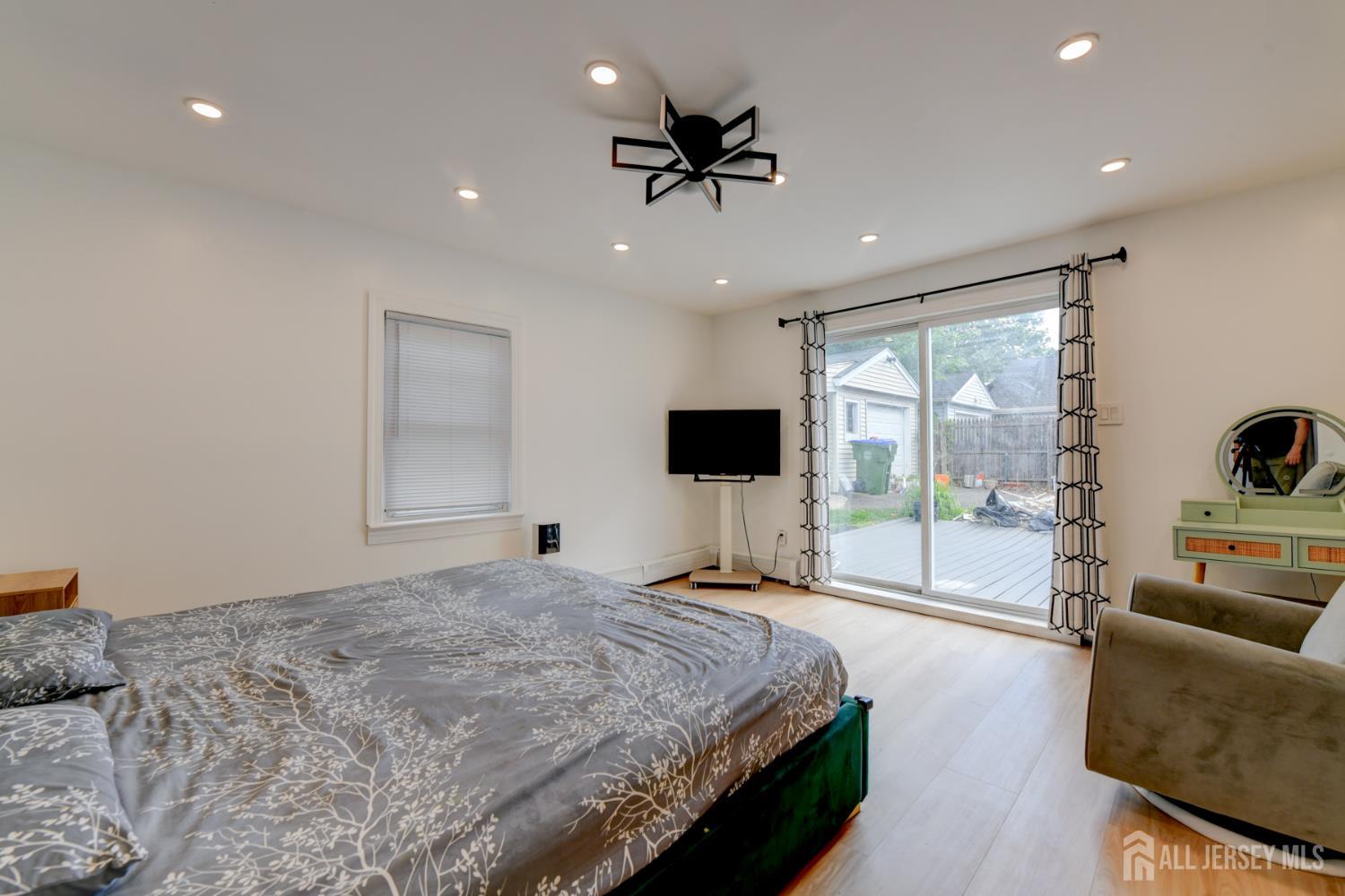 50 Chestnut Street Edison, NJ 08817 - Photo 21 of 36 a bedroom with a bed and a large window