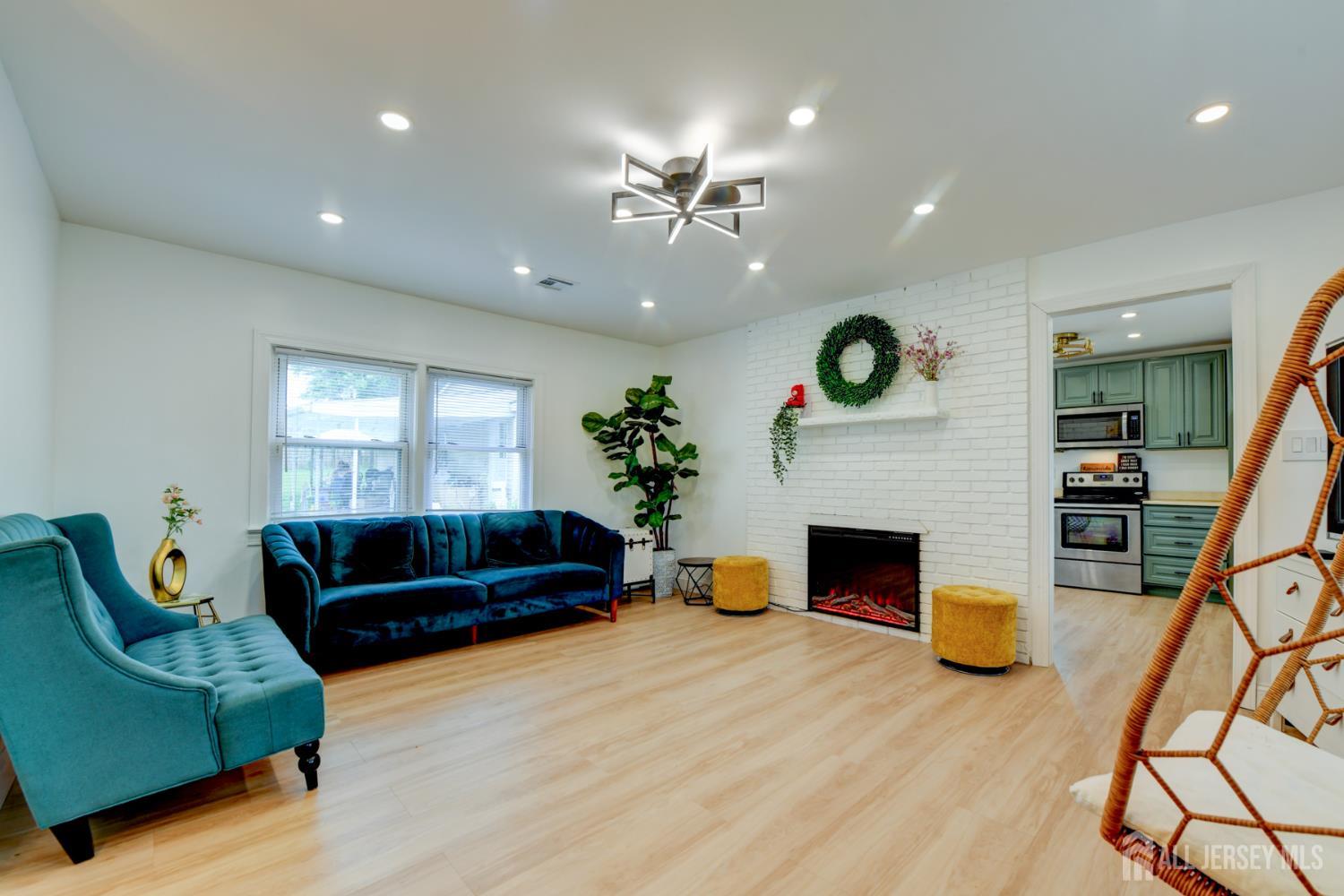 50 Chestnut Street Edison, NJ 08817 - Photo 27 of 36 a living room with furniture and a fireplace