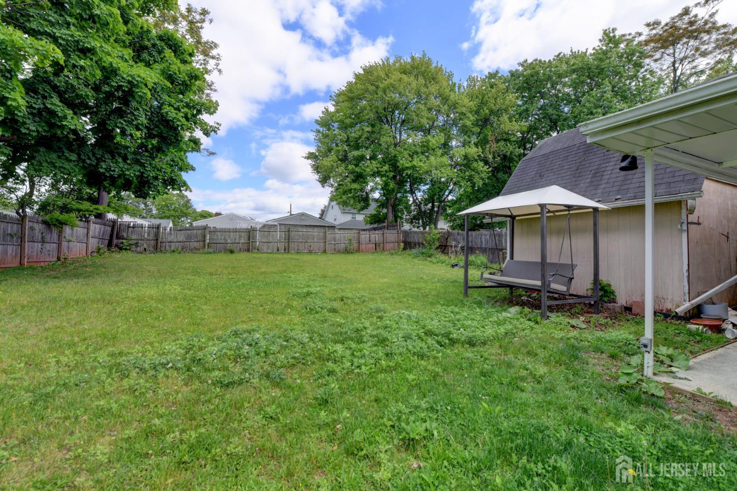 50 Chestnut Street Edison, NJ 08817 - Photo 28 of 36 a view of a house with a yard and sitting area