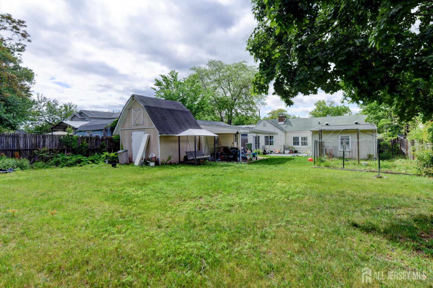 50 Chestnut Street Edison, NJ 08817 - Photo 29 of 36 a view of a house with backyard and garden