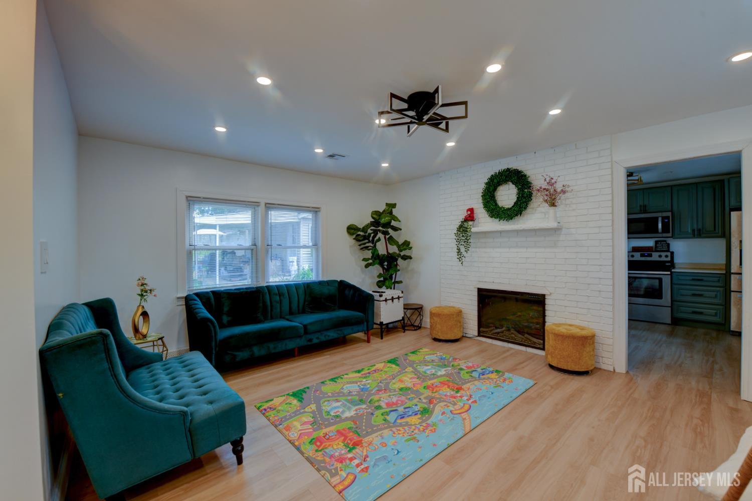 50 Chestnut Street Edison, NJ 08817 - Photo 3 of 36 a living room with furniture and a fireplace