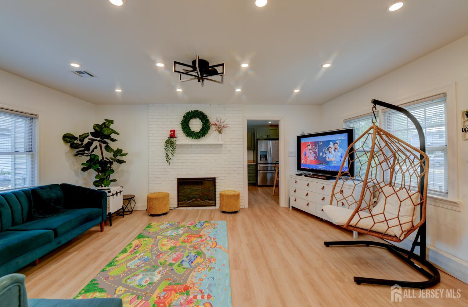 50 Chestnut Street Edison, NJ 08817 - Photo 4 of 36 a living room with furniture and a fireplace