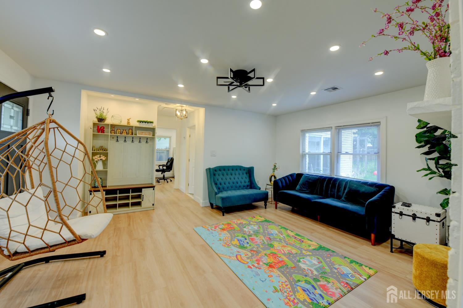 50 Chestnut Street Edison, NJ 08817 - Photo 5 of 36 a living room with furniture and a rug
