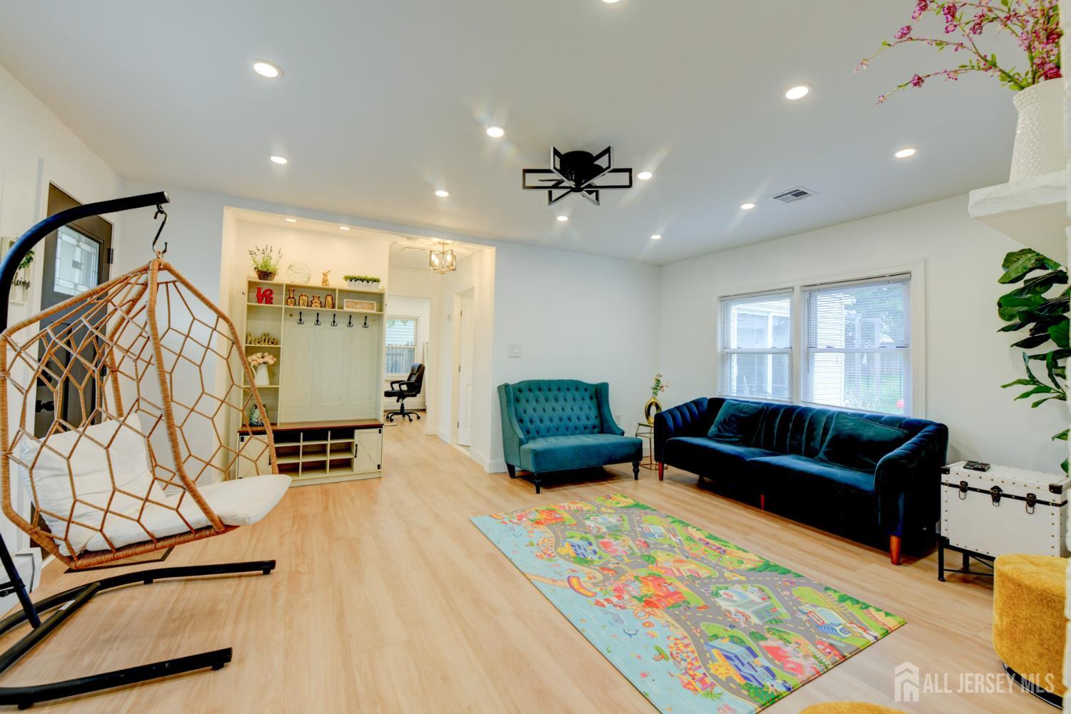 50 Chestnut Street Edison, NJ 08817 - Photo 7 of 36 a living room with furniture rug and wooden floor