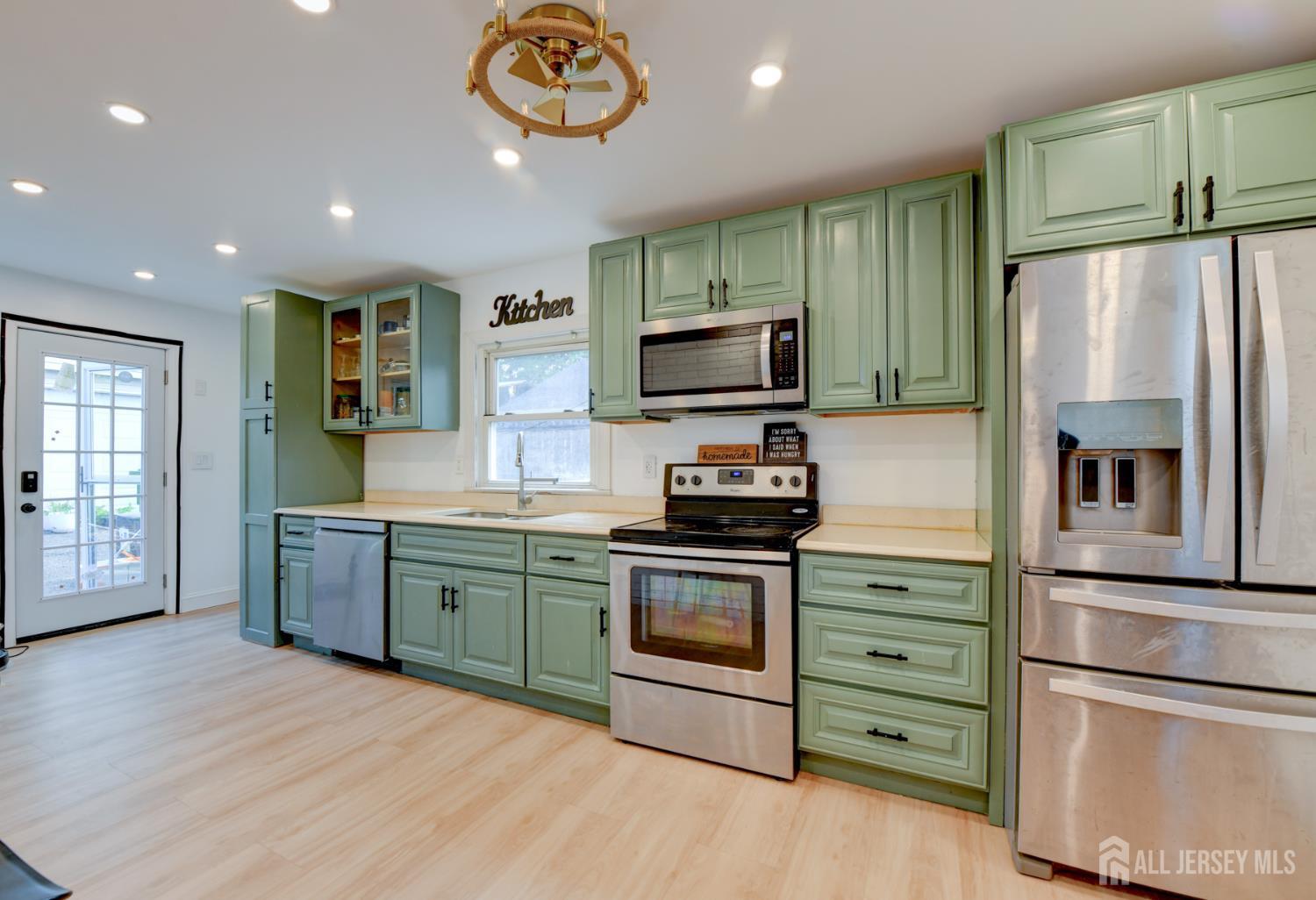 50 Chestnut Street Edison, NJ 08817 - Photo 9 of 36 a kitchen with stainless steel appliances granite countertop a refrigerator stove and oven