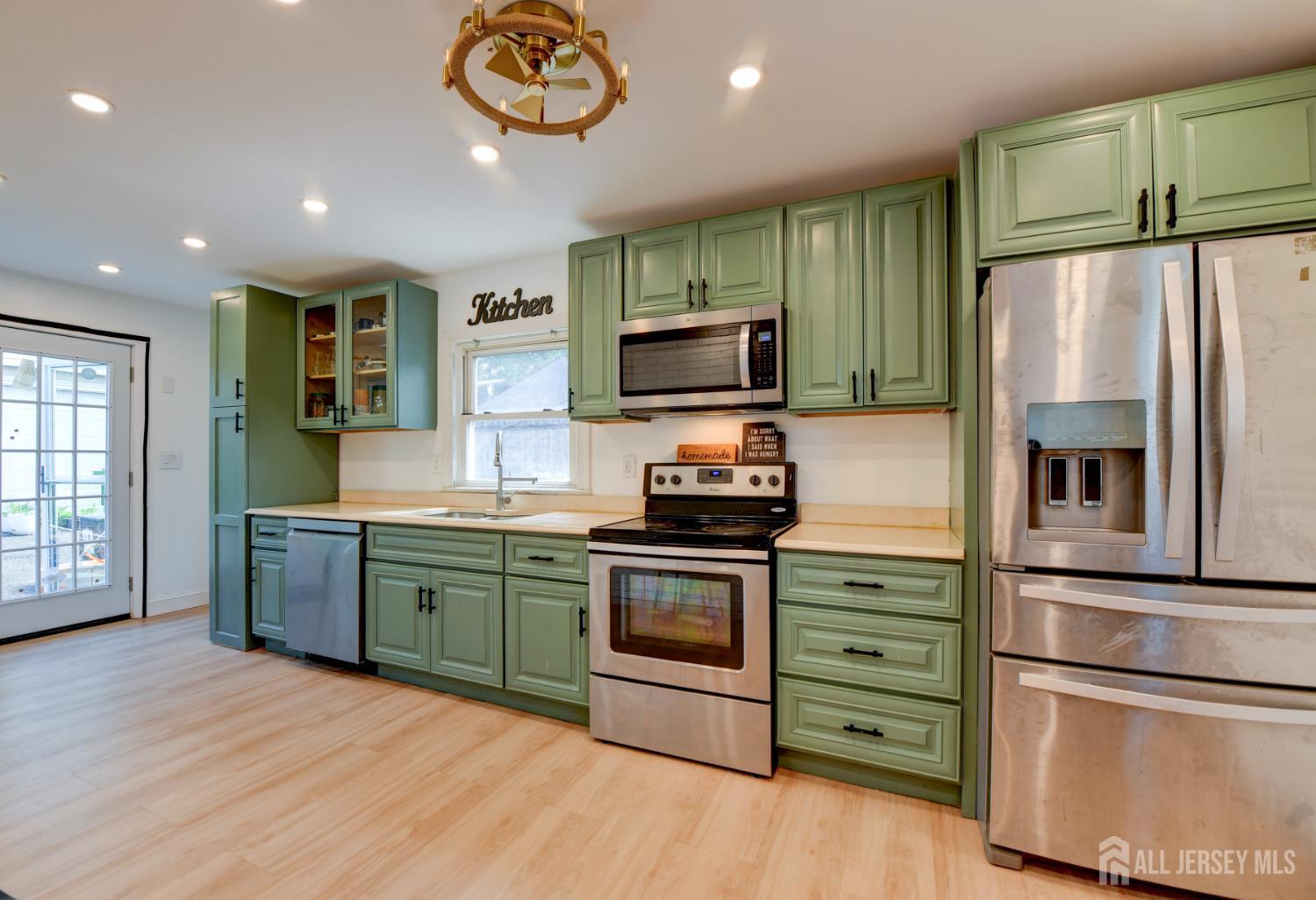 50 Chestnut Street Edison, NJ 08817 - Photo 10 of 36 a kitchen with stainless steel appliances granite countertop a refrigerator stove and sink