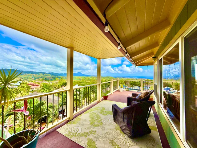 a view of roof deck with furniture