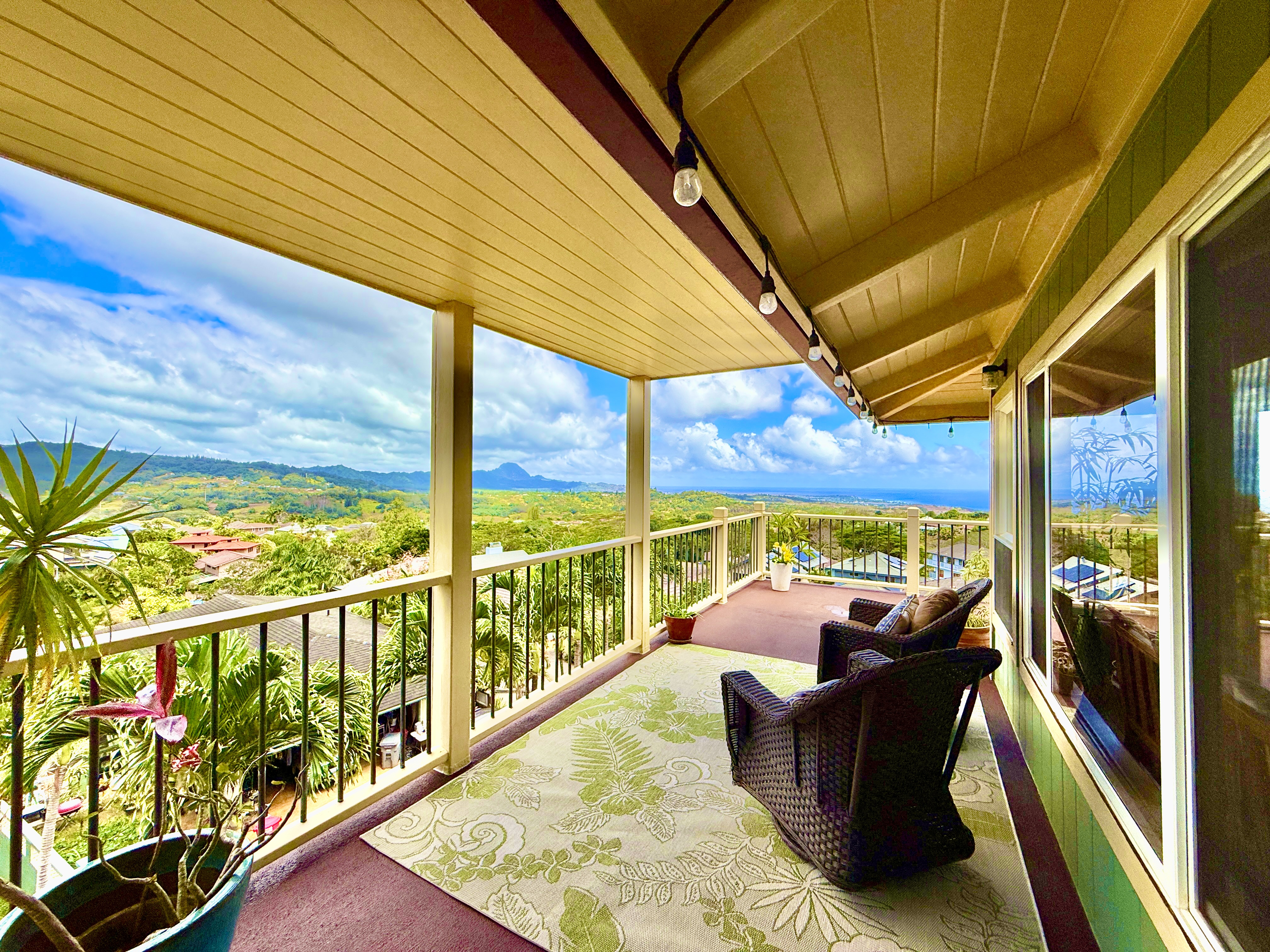 a view of roof deck with furniture