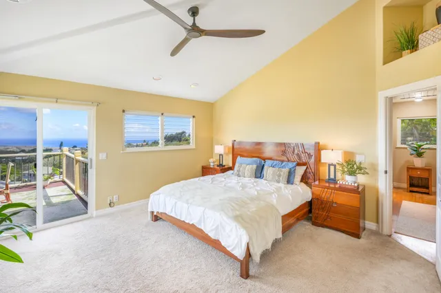 a bedroom with a bed a table and chairs