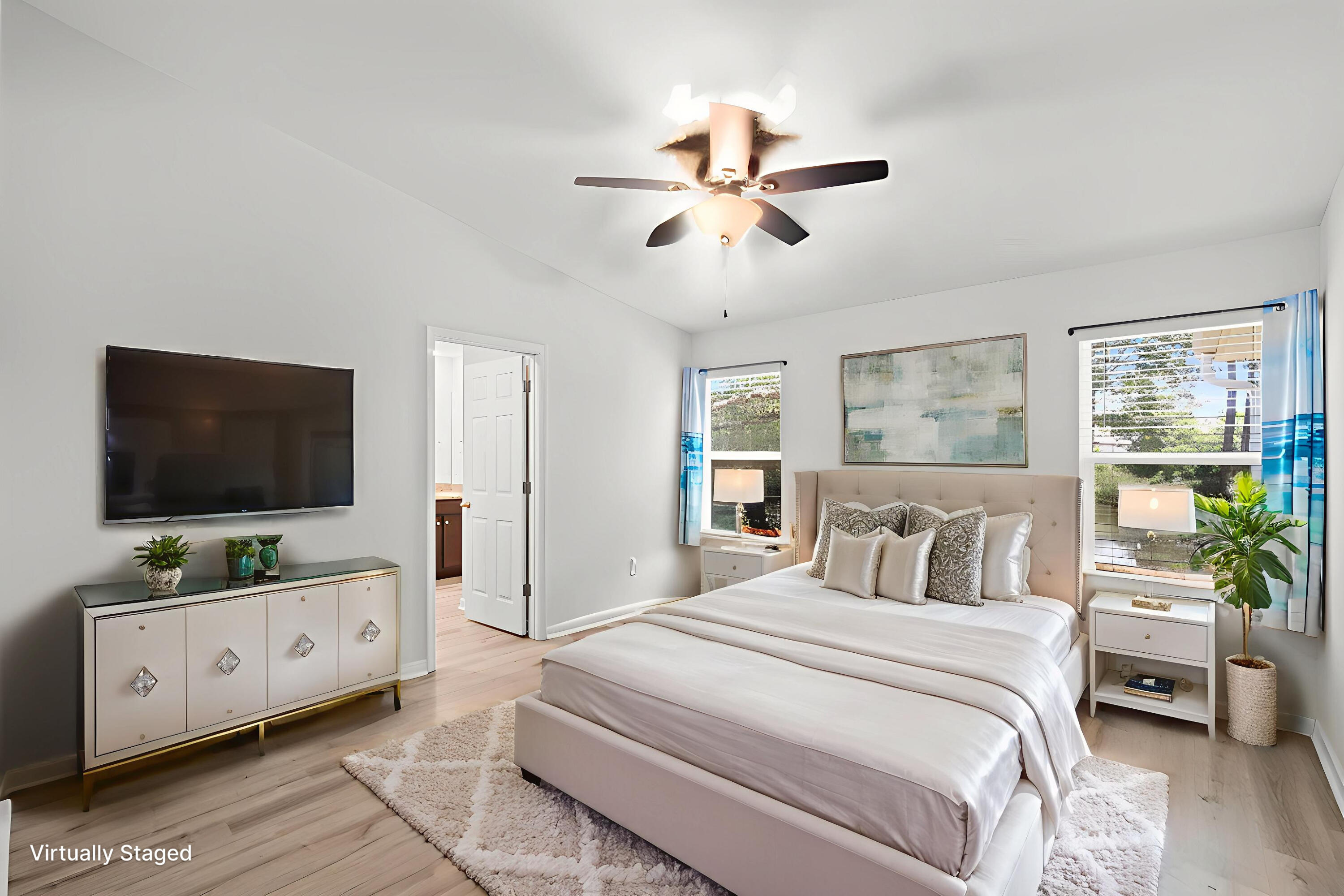 378 Marquis Way Freeport, FL 32439 - Photo 15 of 37 a bedroom with a large bed and a flat tv screen on dresser