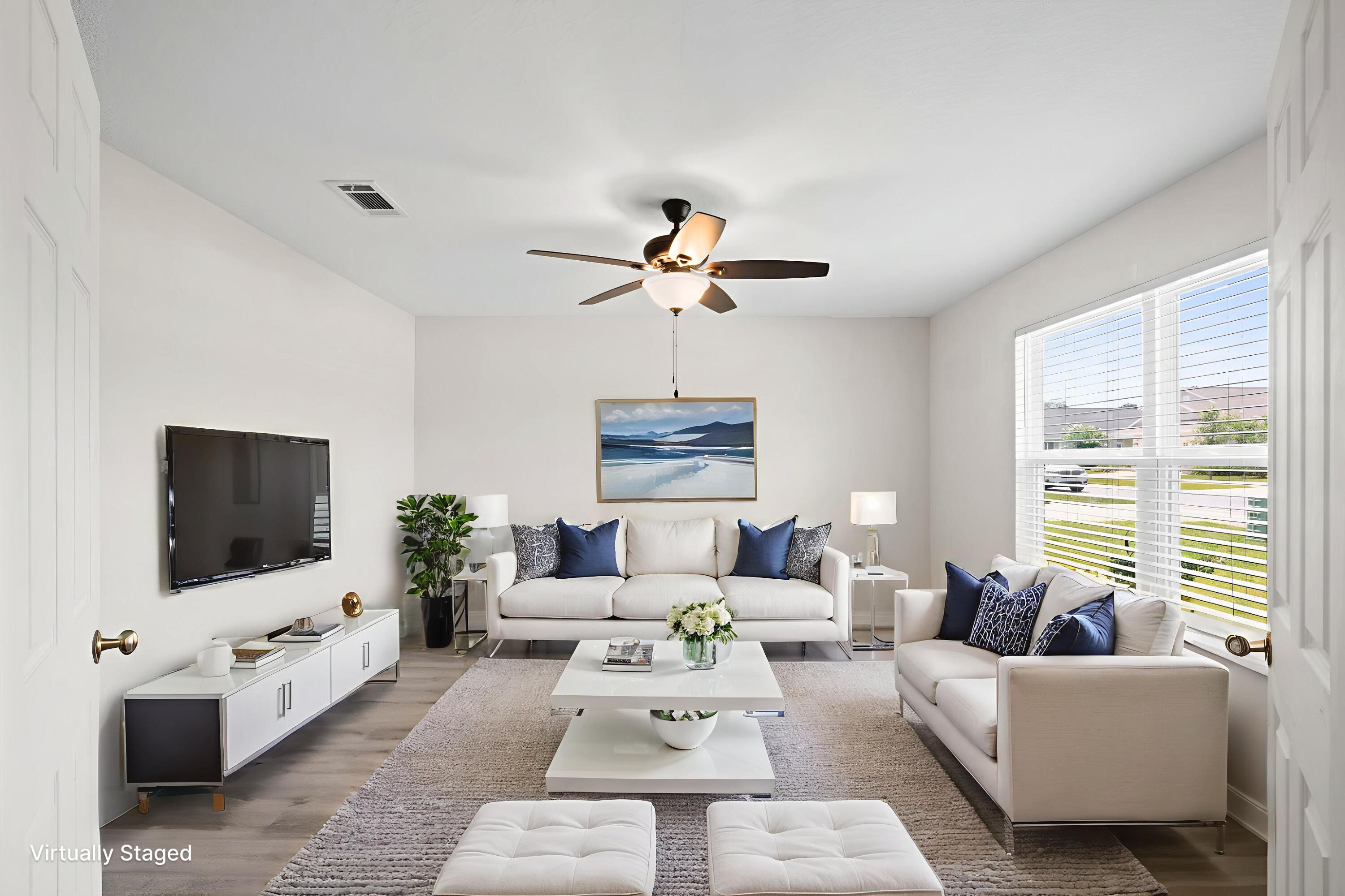 378 Marquis Way Freeport, FL 32439 - Photo 21 of 37 a living room with furniture a flat screen tv and a window